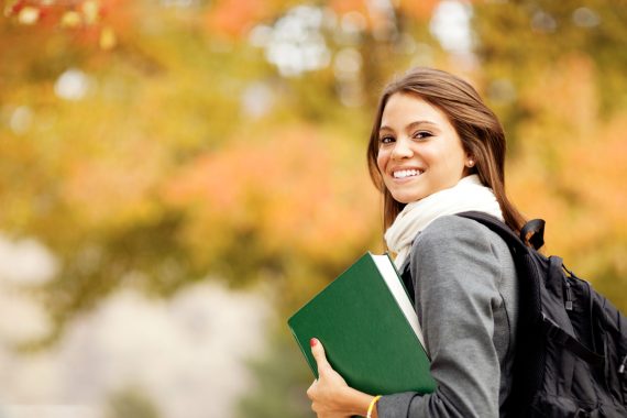 Watering a small plant with water droplets.