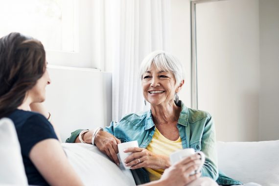 Happy women having tea together.