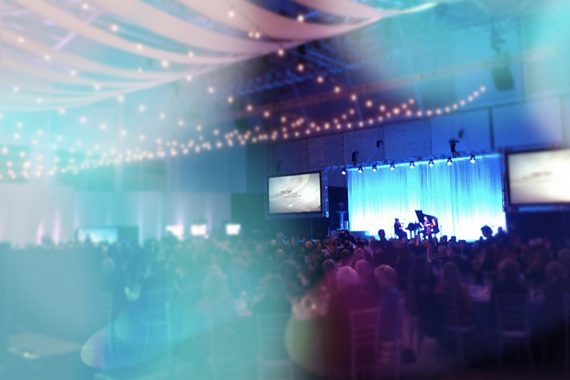 Full audience at a campaign event with piano feature