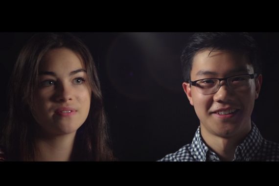 Two students smiling