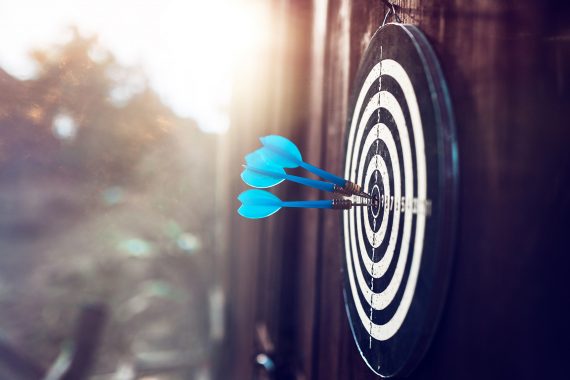 Blue darts on an outdoor target